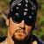 Taker wearing shades and a bandanna.