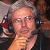Eric with glasses and commentating.