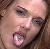 Lita, back in ECW, sticking her tongue out to show her tongue ring.